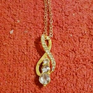 Elegant Gold and Silver Pendant Necklace With Little Gold Pouch